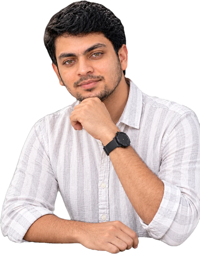 Jithu Sygal in a white striped shirt, chin resting on his hand